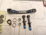 Adaptador Shimano +20mm Post Mount Del/tras